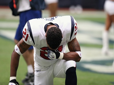 Ein Footballer betet
